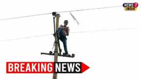 Drunk auto driver climbs atop electric pole after accident to escape public wrath | Watch